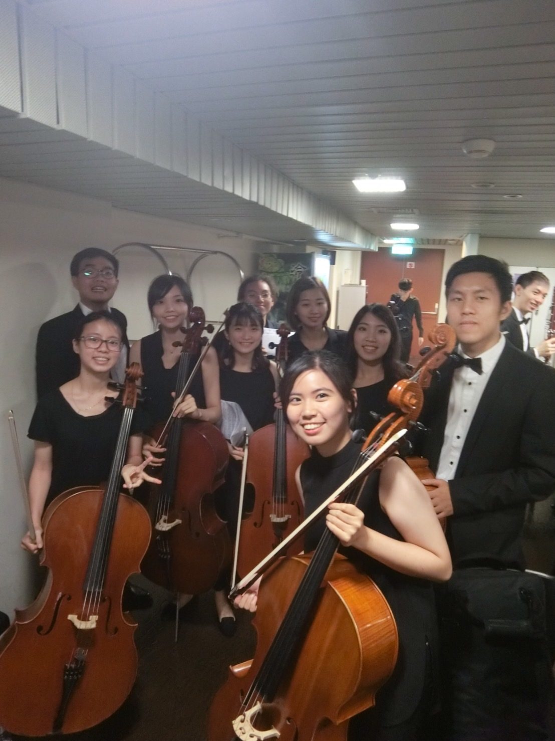 Cello section backstage after a concert